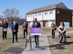 Federal Minister of Housing and Diversity and Inclusion Ahmed Hussen, centre, speaks during a press conference in Windsor on Thursday, March 17, 2022 regarding new housing in the city.