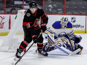 Senators forward Drake Batherson during the game he suffered a high ankle sprain, courtesy of Sabers goalie Aaron Dell, right, on Jan. 25. ERROL McGIHON/SUN FILES
