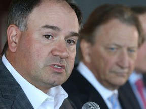 Ottawa Senators general manager Pierre Dorion, seen in September 2017 with Eugene Melnyk in the background, said Melnyk 'should be remembered as someone who cared a lot about the Ottawa Senators, who wanted to see them have success.'