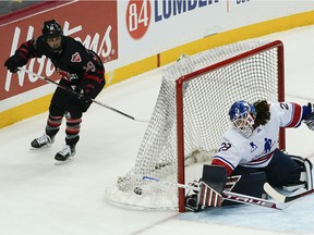The puck is in the net after Canada's Marie-Philip Poulin scored on US goalie Nicole Hensley in overtime of a Rivalry Rematch game on March 12, 2022, in Pittsburgh.