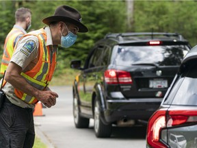 Park rangers checking for camping permits and day-use permits visitors were required to have to enter Golden Ears Provincial Park in Maple Ridge last summer.