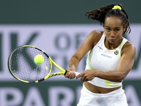 Leylah Fernandez of Laval returns a shot to American Amanda Anisimova during the BNP Paribas Open at the Indian Wells Tennis Garden on Saturday, March 12, 2022, in Indian Wells, Calif.