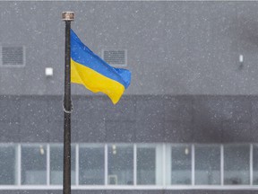 The Ukrainian flag is flown at Charles Clark Square against the backdrop of City Hall in downtown Windsor, on Friday, February 25, 2022, in solidarity with Ukraine as the country tries to defend itself against a Russian invasion.