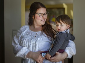 Nicole Matchett holds her 10-month-old son, Kian, at her home on Tuesday, March 29, 2022. Matchett is pleased with the newly announced childcare announcement.