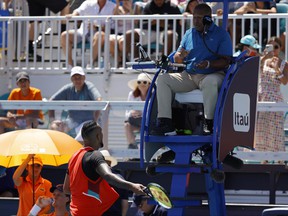 Nick Kyrgios argues with chair umpire Carlos Bernardes after being assessed a point penalty during the first set tiebreaker against Jannik Sinner (not pictured) in a fourth round men's singles match in the Miami Open at Hard Rock Stadium, March 29, 2022.