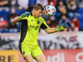 CF Montréal goalkeeper Sebastian Breza heads the ball during the second half against the New York Red Bulls at Red Bull Arena in Harrison, NJ, on Oct. 30, 2021