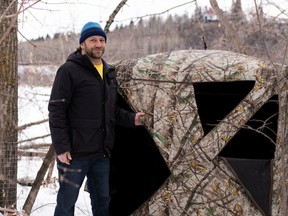 Stealth camper Steve Wallis sets up a hunting hide in Edmonton's Buena Vista Park.