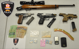 Windsor police have released this photo of the guns, ammunition, cash and drugs found during a Thursday raid of a home in the 1400 block of Pillette Road.