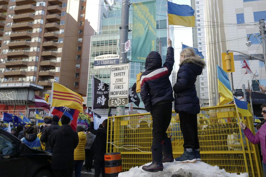 Young Ukrainian supporters wave flags at the rally held by Ukrainian Canadian Congress, which closed down St. Claire Ave from Yonge St to Avoca Ave. on Sunday.