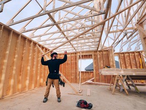 Jordan Ellis, a framer with JS Ellis Construction works on a single family housing build in the 1300 block of Clearwater Avenue in Windsor on Thursday, March 10, 2022.