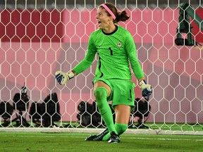 Canada's goalkeeper Stephanie Labbe celebrates after saved a penalty kick during the penalty shoot-out of the Tokyo 2020 Olympic Games women's final football match between Sweden and Canada at the International Stadium Yokohama in Yokohama on August 6, 2021.