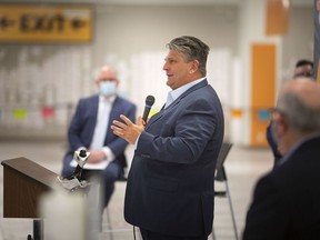 Windsor Regional Hospital CEO David Musyj expresses thanks to all behind the mass COVID-19 vaccination site at the Devonshire Mall. Windsor Mayor Drew Dilkens looks on.  Photographed March 29, 2022.