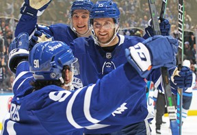Maple Leafs' Ilya Mikheyev and Alexander Kerfoot congratulate teammate John Tavares on his goal against the Winnipeg Jets at Scotiabank Arena on Thursday, March 31, 2022 in Toronto.  CLAUS ANDERSEN/GETTY IMAGES