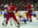 Montreal Canadiens goaltender Jake Allen (34) makes a glove save against the Carolina Hurricanes during the first period at PNC Arena on Thursday, March 31, 2022.