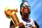 Kyle Lowry #7 of the Toronto Raptors holds the championship trophy during the Toronto Raptors Victory Parade on June 17, 2019 in Toronto, Canada.