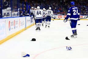 Hats litter the ice after Maple Leafs' Auston Matthews scores his third goal of the game against the Lightning.  MIKE EHRMANN/GETTY IMAGES
