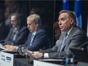 Premier François Legault, right, was joined by education minister Jean-Francois Roberge, left, and interim public health director Luc Boileau last week.  Our trust in the government to keep Quebec functioning at the most basic level has been shaken, Allison Hanes writes.