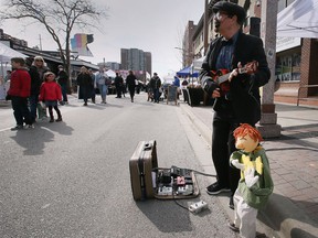 Matthew Romain performs at the Downtown Windsor Farmers' Market on Saturday, April 2, 2002.