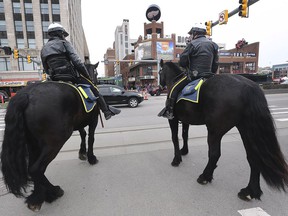 Mounted Detroit police officers are shown on Thursday, April 4, 2019, at the Detroit Tigers opening day near Comerica Park.