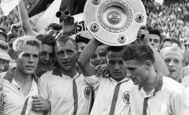 Eintracht Frankfurt players celebrate winning the 1959 German championship title