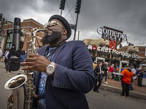 Musician Aaron McAfee performs on the saxophone outside of Comerica Park in Detroit, MI, where the Detroit Tigers are hosting the Chicago White Sox to kick off the 2022 season of Major League Baseball, on Friday, April 8, 2022.
