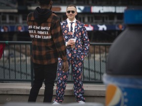 A Tigers fan displays his Tiger suit inside Comerica Park for opening day in downtown Detroit where the Detroit Tigers are hosting the Chicago White Sox to kick off the 2022 season of Major League Baseball, on Friday, April 8, 2022.