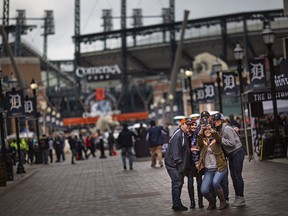 Baseball fans take a group photo in downtown Detroit, MI, where the Detroit Tigers are hosting the Chicago White Sox to kick off the 2022 season of Major League Baseball, on Friday, April 8, 2022.