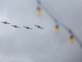 Four A-10 Thunderbolt “Warthog” aircrafts from the 107th Fighter Squadron at Selfridge Air National Guard Base perform a flyover for opening day where the Detroit Tigers are hosting the Chicago White Sox to kick off the 2022 season of Major League Baseball, on Friday, April 8, 2022.