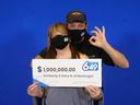 Kimberly and Gary Noel of McGregor hold up their -million prize check from the Lotto 6/49 draw of Nov. 27, 2021.