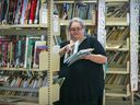Document technician Luanna Venditti tidies the shelves at Laval Junior Academy. 