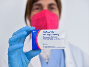 Dr. Cesira Nencioni, director of infectious diseases at Misericordia hospital in Italy, holds Paxlovid pills.