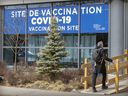 A man enters the COVID-19 vaccination clinic on Parc Ave. in Montreal on Monday April 11, 2022.