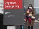 Walking past the emergency entrance at Montreal's Jewish General Hospital on March 31, 2022. 