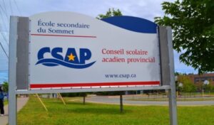 A red, white, and blue sign that says Le Conseil scolaire acadien provincial