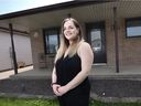Rebecca Sellan, a recent University of Windsor graduate, stands outside her parent's home in Windsor's Remington Park area on May 20, 2021.