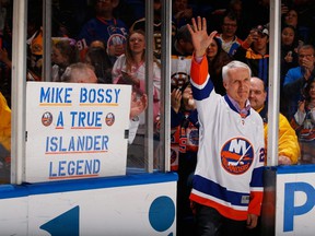 Former New York Icelanders Mike Bossy waves to the crowd prior to the game during Mike Bossy tribute Night at the Nassau Veterans Memorial Coliseum on January 29, 2015 in Uniondale, New York.