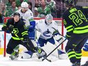 Luke Schenn kept Jason Robertson from getting to the net March 26 during the Canucks' 4-1 win in Dallas.