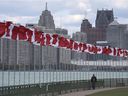 Drawing visitors, workers, students from across the border is one of the recommendations of a proposed new economic diversification strategy for Windsor.  Shown here on Oct 8, 2020, the Flags of Remembrance fly along the riverfront with downtown Detroit in the background.
