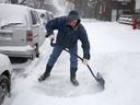 A man shovels snow in this file photo.
