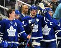 Apr 9, 2022;  Toronto, Ontario, CAN;  Toronto Maple Leafs forward Auston Matthews (middle) acknowledges a tribute by fans after setting a new Maple Leafs single season record for goals during a break in action against the Montreal Canadiens at Scotiabank Arena.  