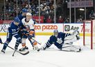 Maple Leafs' Timothy Liljegren battles in front of goaltender Jack Campbell with New York Islanders' Anthony Beauvillier during the second period at Scotiabank Arena on Sunday, April 17, 2022. 