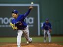 Blue Jays starting pitcher Yusei Kikuchi (16) pitches during the first inning against the Boston Red Sox at Fenway Park. 