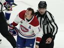 Canadiens' Brendan Gallagher skates off the ice with linesman Michel Cormier after a skirmish on the ice late in the third period of Game 1 of the Stanley Cup final Monday night in Tampa.