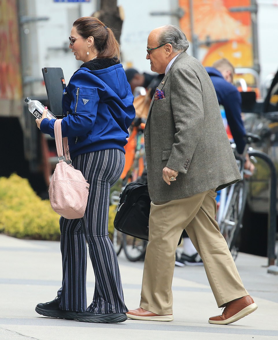 Giuliani, 77, looked dapper on Thursday morning as he walked to work, his girlfriend, 57-year-old Dr. Maria Ryan, at his side.