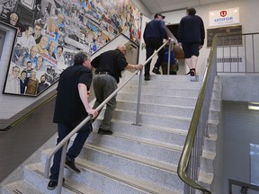 UNIFOR local 444 members make their way into a meeting at the Turner Road hall in Windsor on Thursday, April 21, 2022.