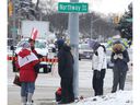 A small group of demonstrators are shown at the intersection of Tecumseh Road West and Northway Avenue on Monday, February 14, 2022.
