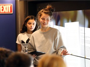 Tecumseh Vista Academy Grade 10 students Olivia Hadjissarris, right, and Sophia Vidinovski, behind, present answers inside the Holodomor Mobile Classroom Monday Nov. 26, 2018. Students participate in lively group discussions while learning about the Ukrainian genocide.  This year marks the 85th anniversary of Holodomor, which refers to the genocidal starvation of millions of Ukrainians in 1932-33.  A mobile classroom, currently touring the country to inform Canadians about the Ukrainian genocide, will visit 5 GECDSB secondary schools this week.