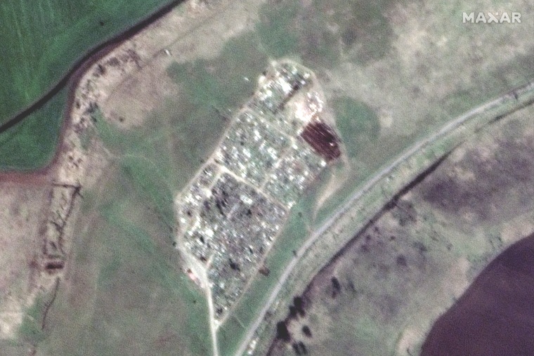 A satellite view of an apparent expansion of graves at a cemetery in Vynohradne, Ukraine, on April 15.