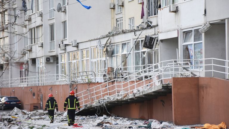 Firefighters walk past an apartment building damaged by Russian bombing in Odessa, Ukraine.  Photo: AP