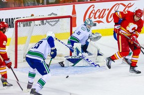 Apr 23, 2022;  Calgary, Alberta, CAN;  Vancouver Canucks goaltender Thatcher Demko (35) guards his net against the Calgary Flames during the first period at Scotiabank Saddledome.